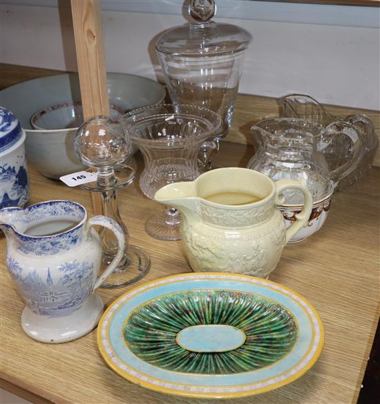 A quantity of cut glass including two jugs, two bowls and a maiolica dish
